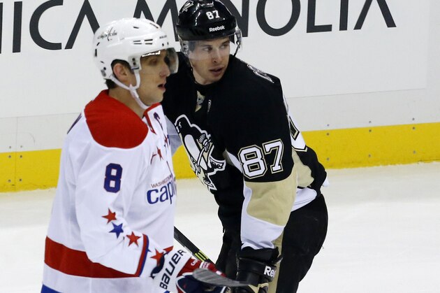 Pittsburgh Penguins' Sidney Crosby (87) and Washington Capitals' Alex Ovechkin (8) skate during an NHL hockey game between the Pittsburgh Penguins and the Washington Capitals in Pittsburgh, Wednesday, Jan. 15, 2014. The Penguins won 4-3.(AP Photo/Gene J. Puskar)