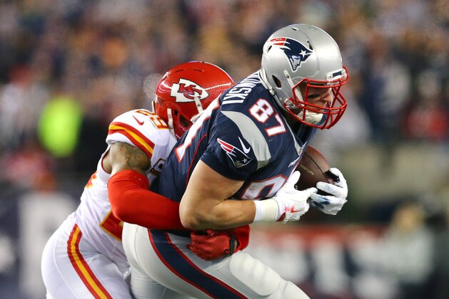 FOXBORO, MA - JANUARY 16:  Eric Berry #29 of the Kansas City Chiefs attempts to tackle Rob Gronkowski #87 of the New England Patriots during the AFC Divisional Playoff Game at Gillette Stadium on January 16, 2016 in Foxboro, Massachusetts.  (Photo by Maddie Meyer/Getty Images)
