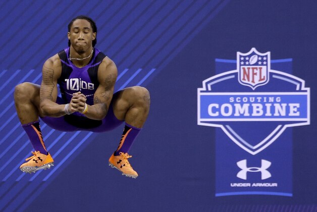Florida State defensive back Ronald Darby jumps before running the 40-yard dash at the NFL football scouting combine in Indianapolis, Monday, Feb. 23, 2015. (AP Photo/Julio Cortez)
