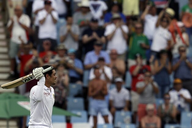 South Africa’s batsman Quinton de Kock, raises his bat after reaching a century on the second day of the fourth test cricket match between South Africa and England, at Centurion Park in Pretoria, South Africa, Saturday, Jan. 23, 2016. (AP Photo/Themba Hadebe)