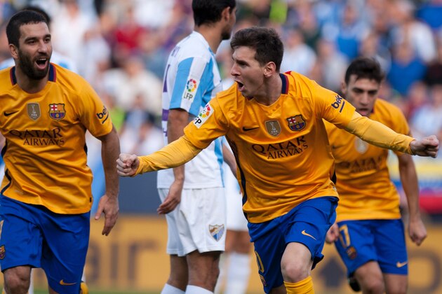 Barcelona's Argentinian forward Lionel Messi celebrates after scoring during the Spanish league football match Malaga CF vs FC Barcelona at La Rosaleda stadium in Malaga on January 23, 2016.  AFP PHOTO / JORGE GUERRERO / AFP / Jorge Guerrero        (Photo credit should read JORGE GUERRERO/AFP/Getty Images)