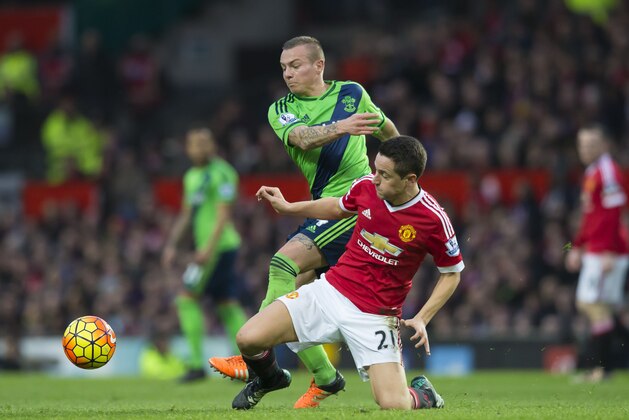 Manchester United's Abder Herrera, right, fights for the ball against Southampton's Jordy Clasie during the English Premier League soccer match between Manchester United and Southampton at Old Trafford Stadium, Manchester, England, Saturday, Jan. 23, 2016. (AP Photo/Jon Super)