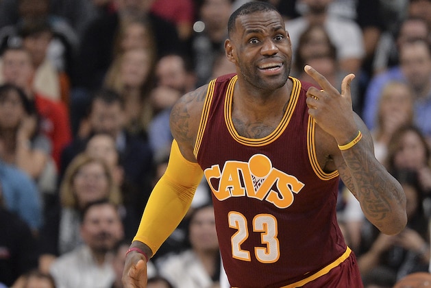 Cleveland Cavaliers forward LeBron James gestures to the Cleveland bench during the second half of an NBA basketball game against the San Antonio Spurs, Thursday, Jan. 14, 2016, in San Antonio. San Antonio won 99-95. (AP Photo/Darren Abate)