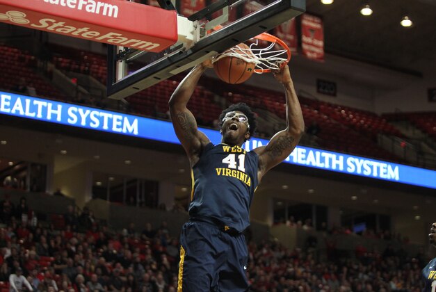 Jan 23, 2016; Lubbock, TX, USA; West Virginia Mountaineers forward Devin Williams (41) slam dunks the ball against the Texas Tech Red Raiders in the first half at United Supermarkets Arena. Mandatory Credit: Michael C. Johnson-USA TODAY Sports