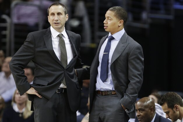 Cleveland Cavaliers head coach David Blatt, left, talks with assistant Tyronn Lue in the fourth quarter of an NBA basketball game against the Minnesota Timberwolves Tuesday, Dec. 23, 2014, in Cleveland. (AP Photo/Mark Duncan)