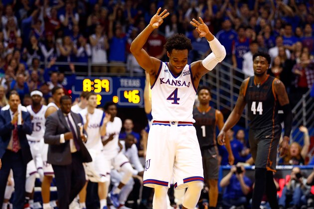 LAWRENCE, KS - JANUARY 23:  Devonte' Graham #4 of the Kansas Jayhawks reacts after making a three-pointer during the game against the Texas Longhorns at Allen Fieldhouse on January 23, 2016 in Lawrence, Kansas.  (Photo by Jamie Squire/Getty Images)