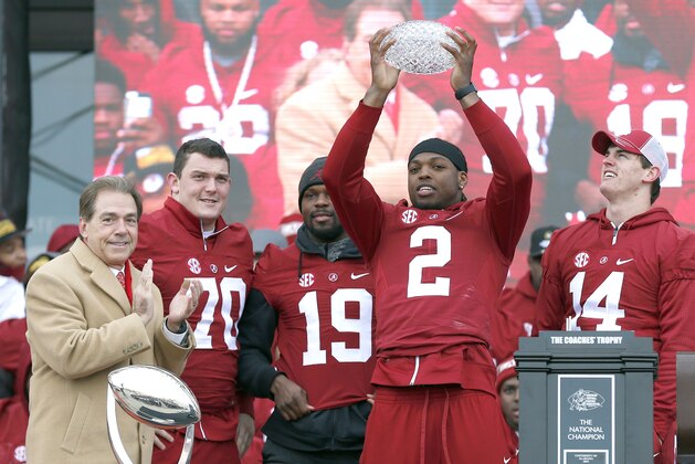 Jan 23, 2016; Tuscaloosa, AL, USA; Alabama running back Derrick Henry (2) holds up the Crystal trophy with coach Nick Saban (left), offensive lineman Ryan Kelly (70), linebacker Reggie Ragland (19), and quarterback Jake Coker (14) during a presentation to celebrate the victory in the CFP National Championship game at Bryant-Denny Stadium. Mandatory Credit: Butch Dill-USA TODAY Sports