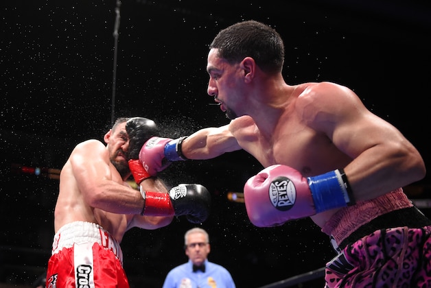 Danny Garcia, right, throws a punch at Robert Guerrero during their WBC championship welterweight bout, Saturday, Jan. 23, 2016, in Los Angeles. (AP Photo/Mark J. Terrill)