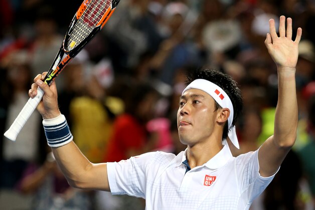 Kei Nishikori of Japan celebrates after defeating Jo-Wilfried Tsonga of France in their fourth round match at the Australian Open tennis championships in Melbourne, Australia, Sunday, Jan. 24, 2016.(AP Photo/Rick Rycroft)
