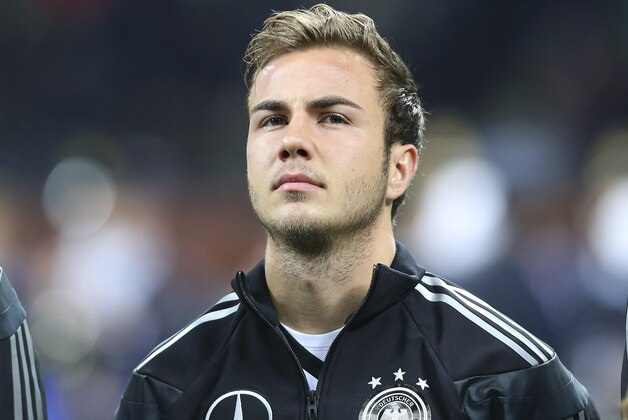 Germany midfielder Mario Gotze stands prior to the start of a friendly soccer match between Italy and Germany at the San Siro  stadium in Milan, Italy, Friday, Nov. 15, 2013. (AP Photo/Antonio Calanni)