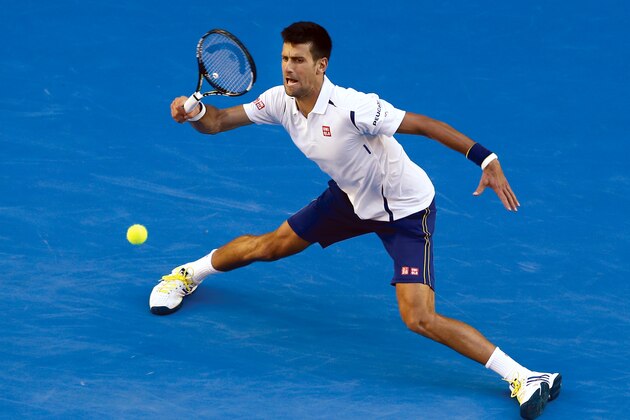 Novak Djokovic of Serbia hits a forehand return during his fourth round match against Gilles Simon of France at the Australian Open tennis championships in Melbourne, Australia, Sunday, Jan. 24, 2016.(AP Photo/Rafiq Maqbool)