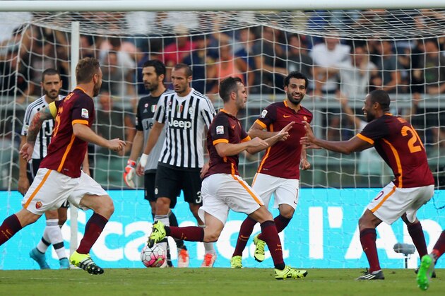 ROME, ITALY - AUGUST 30:  Miralem Pjanic (C) with his teammates of AS Roma celebrates after scoring the opening goal during the Serie A match between AS Roma and Juventus FC at Stadio Olimpico on August 30, 2015 in Rome, Italy.  (Photo by Paolo Bruno/Getty Images)