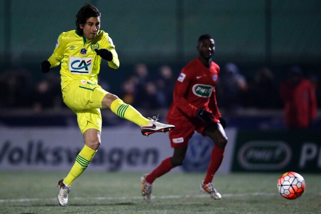 Nantes' US midfielder Alejandro Bedoya (L) kicks to score a goal during the French Cup football match between Mantes (FCM) and Nantes (FCN) at Bergeal stadium, in Mantes-la-Ville, on January 20, 2015. AFP PHOTO / KENZO TRIBOUILLARD / AFP / KENZO TRIBOUILLARD        (Photo credit should read KENZO TRIBOUILLARD/AFP/Getty Images)