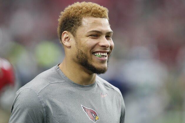 Injured Arizona Cardinals free safety Tyrann Mathieu watches warm ups prior to an NFL football game against the Seattle Seahawks, Sunday, Jan. 3, 2016, in Glendale, Ariz. (AP Photo/Rick Scuteri)