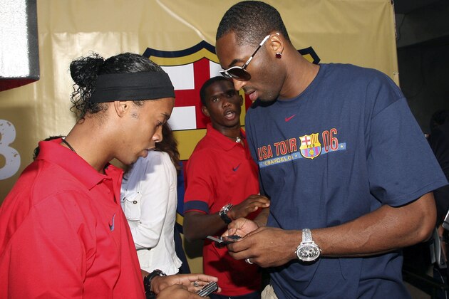 HOLLYWOOD - AUGUST 5:  (L-R)  Ronaldinho of Brazil and Kobe Bryant of the Los Angeles Lakers speak at Nike European Club Champion FC Barcelona Rally at Hollywood and Highland on August 5, 2006 in Hollywood, California.  (Photo Frederick M. Brown/ Getty Images).