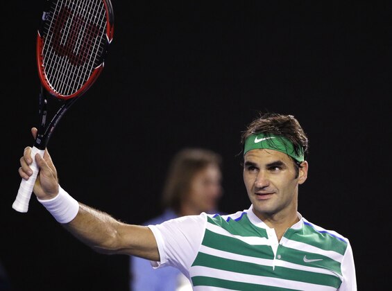 Roger Federer of Switzerland celebrates after defeating David Goffin of Belgium in their fourth round match at the Australian Open tennis championships in Melbourne, Australia, early Monday, Jan. 25, 2016.(AP Photo/Aaron Favila)