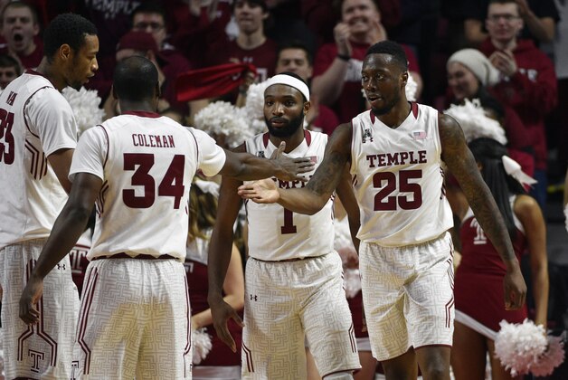 Jan 24, 2016; Philadelphia, PA, USA; Temple Owls guard Quenton DeCosey (25) celebrates a score with Devin Coleman (34), Josh Brown (1) and Devontae Watson (23) during the first half against the Southern Methodist Mustangs at Liacouras Center. Mandatory Credit: Derik Hamilton-USA TODAY Sports