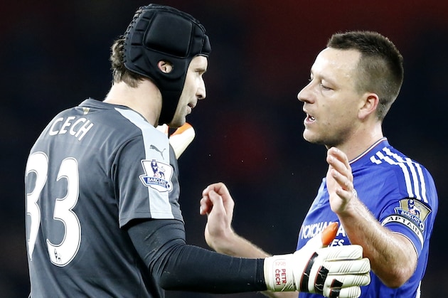 Chelsea's John Terry, right goes hug his former teammate and now Arsenal goalkeeper Petr Cech after the end of the English Premier League soccer match between Arsenal and Chelsea at the Emirates stadium in London, Sunday, Jan. 24, 2016.Chelsea won the game 1-0. (AP Photo/Frank Augstein)