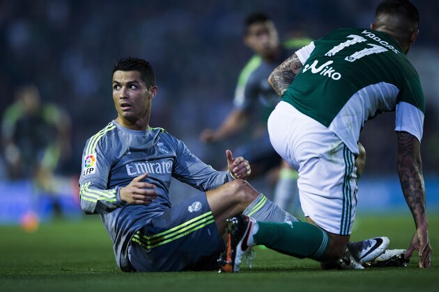 SEVILLE, SPAIN - JANUARY 24:  Cristiano Ronaldo of Real Madrid CF reacts after being tackled by Juan Manuel Vargas (R) of Real Betis Balompie during the La Liga match between Real Betis Balompie and Real Madrid CF at Estadio Benito Villamarin on January 24, 2016 in Seville, Spain.  (Photo by Gonzalo Arroyo Moreno/Getty Images)