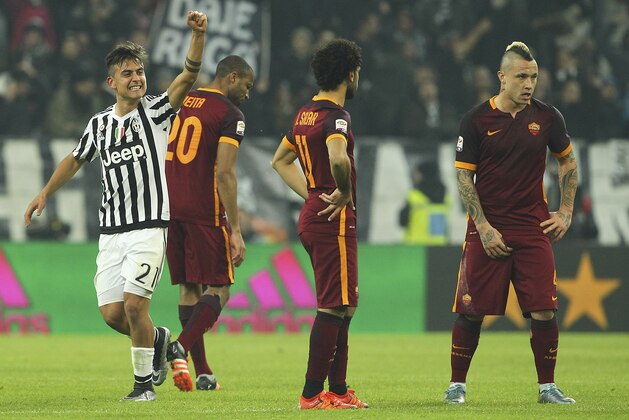 TURIN, ITALY - JANUARY 24:  Paulo Dybala (L) of Juventus FC celebrates after scoring the opening goal during the Serie A match between Juventus FC and AS Roma at Juventus Arena on January 24, 2016 in Turin, Italy.  (Photo by Marco Luzzani/Getty Images)