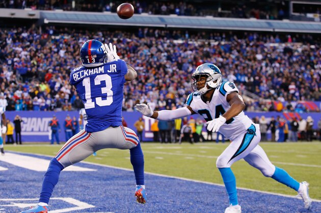 EAST RUTHERFORD, NJ - DECEMBER 20:   Odell Beckham #13 of the New York Giants scores a game tying touchdown against  Josh Norman #24 of the Carolina Panthers in the fourth Quarter during their game at MetLife Stadium on December 20, 2015 in East Rutherford, New Jersey.  (Photo by Al Bello/Getty Images)