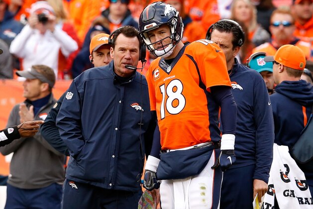 DENVER, CO - JANUARY 24:  Head coach Gary Kubiak of the Denver Broncos speaks to  Peyton Manning #18 in the first half against the New England Patriots in the AFC Championship game at Sports Authority Field at Mile High on January 24, 2016 in Denver, Colorado.  (Photo by Christian Petersen/Getty Images)