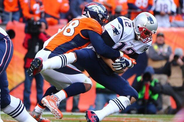 Jan 24, 2016; Denver, CO, USA; New England Patriots quarterback Tom Brady (12) is sacked by Denver Broncos outside linebacker Von Miller (58) in the second half in the AFC Championship football game at Sports Authority Field at Mile High. Mandatory Credit: Mark J. Rebilas-USA TODAY Sports