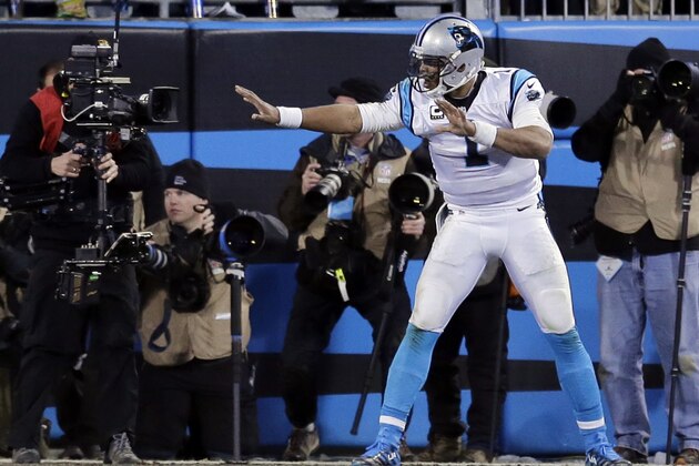 Carolina Panthers' Cam Newton celebrates after a touchdown run during the second half the NFL football NFC Championship game against the Arizona Cardinals,  Sunday, Jan. 24, 2016, in Charlotte, N.C. (AP Photo/David J. Phillip)