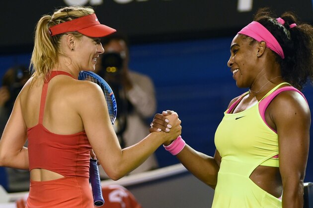 Serena Williams of the US (R) shakes hands as she celebrates after victory in her women's singles final match against Russia's Maria Sharapova (L) on day thirteen of the 2015 Australian Open tennis tournament in Melbourne on January 31, 2015. AFP PHOTO / MAL FAIRCLOUGH -- IMAGE RESTRICTED TO EDITORIAL USE - STRICTLY NO COMMERCIAL USE        (Photo credit should read MAL FAIRCLOUGH/AFP/Getty Images)