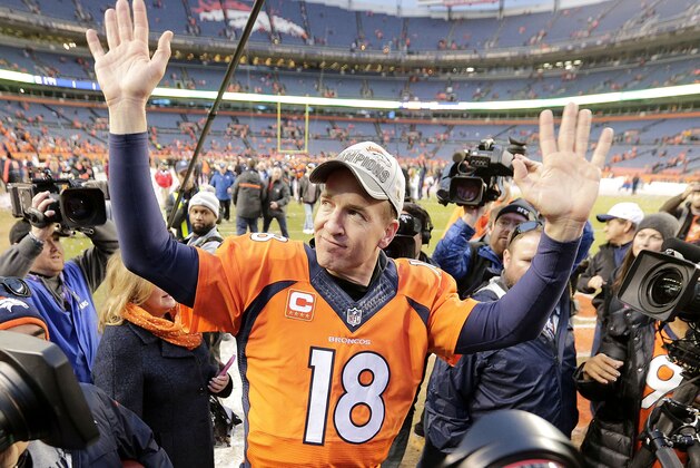 Denver Broncos quarterback Peyton Manning waves to spectators following the NFL football AFC Championship game between the Denver Broncos and the New England Patriots, Sunday, Jan. 24, 2016, in Denver. The Broncos defeated the Patriots 20-18 to advance to the Super Bowl. (AP Photo/Charlie Riedel)