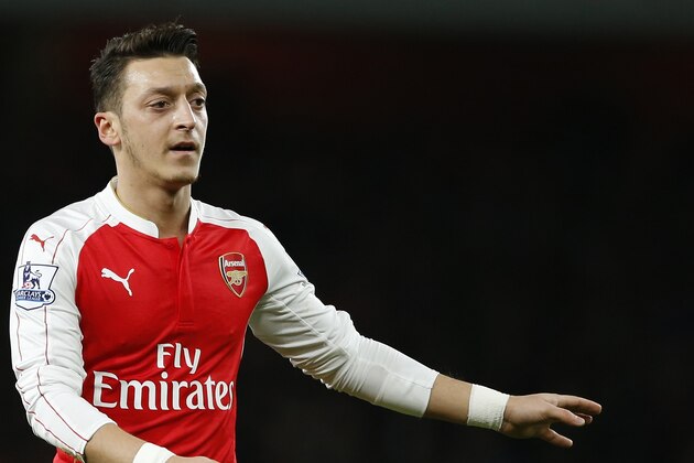 Arsenal's Mesut Ozil gestures during the English Premier League soccer match between Arsenal and Manchester City at the Emirates stadium in London, Monday, Dec. 21, 2015. (AP Photo/Alastair Grant)
