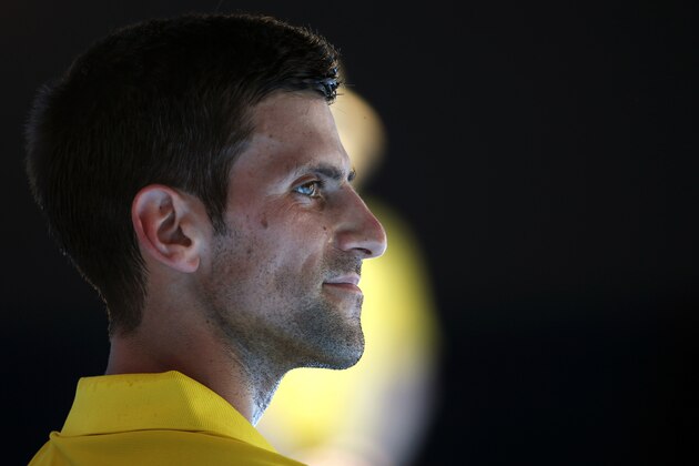Novak Djokovic of Serbia waits in his chair between games during his fourth round match against Gilles Simon of France at the Australian Open tennis championships in Melbourne, Australia, Sunday, Jan. 24, 2016.(AP Photo/Vincent Thian)
