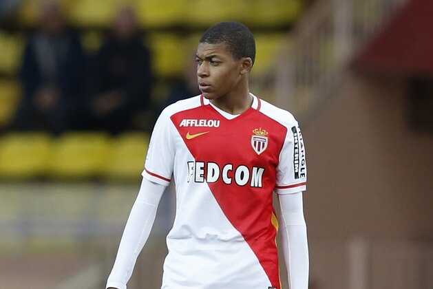 Monaco's French forward Kylian Mbappe Lottin  during the French L1 football match Monaco (ASM) vs Saint Etienne (ASSE) on december 13, 2015 at the 'Louis II Stadium' in Monaco.   / AFP / VALERY HACHE        (Photo credit should read VALERY HACHE/AFP/Getty Images)