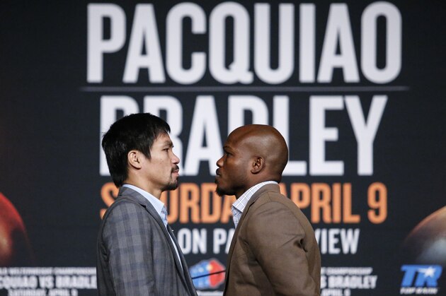 Boxers Manny Pacquiao and Timothy Bradley face each other as they attend a press conference at Madison Square Garden in New York on January 21, 2015, to announce their 12-round welterweight championship fight on April 9 in las Vegas. / AFP / KENA BETANCUR        (Photo credit should read KENA BETANCUR/AFP/Getty Images)