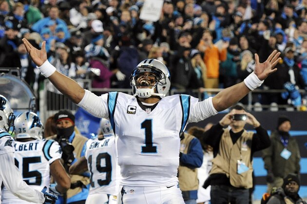 Carolina Panthers' Cam Newton celebrates Ted Ginn's run for a touchdown during the first half the NFL football NFC Championship game against the Arizona Cardinals, Sunday, Jan. 24, 2016, in Charlotte, N.C. (AP Photo/Mike McCarn)