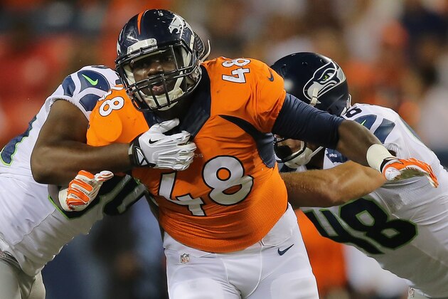 DENVER, CO - AUGUST 07:  Linebacker Shaquil Barrett #48 of the Denver Broncos rushes against the Seattle Seahawks during preseason action at Sports Authority Field at Mile High on August 7, 2014 in Denver, Colorado. The Broncos defeated the Seahawks 21-16.  (Photo by Doug Pensinger/Getty Images)
