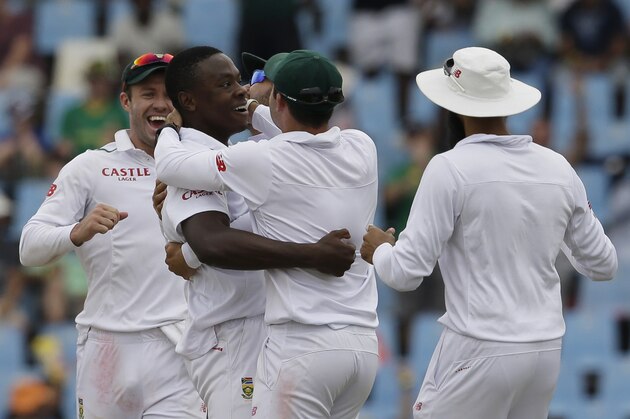 South Africa’s bowler Kagiso Rabada, second from left, celebrates with teammates after dismissing England’s batsman Jonathan Bairstow for a duck on the third day of the fourth test cricket match between South Africa and England at Centurion Park in Pretoria, South Africa, Sunday, Jan. 24, 2016. (AP Photo/Themba Hadebe)