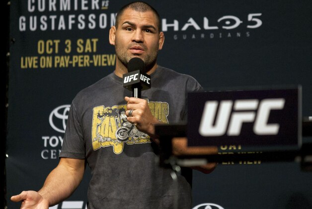 UFC heavyweight fighter Cain Velasquez speaks to UFC fans during a news conference for UFC 192, Friday, Oct. 2, 2015 in Houston. (AP Photo/Juan DeLeon)