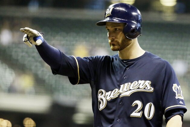 Milwaukee Brewers' Jonathan Lucroy reacts after hitting a two-run scoring single during the fourth inning of a baseball game against the Pittsburgh Pirates Wednesday, Sept. 2, 2015, in Milwaukee. (AP Photo/Morry Gash)