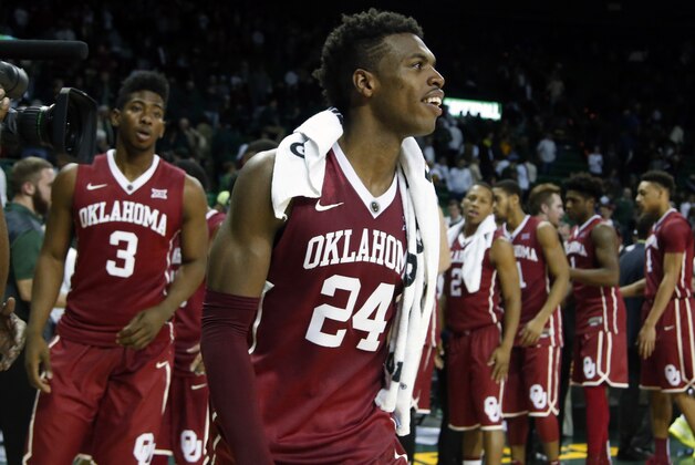Oklahoma guard Buddy Hield (24) and guard Christian James (3) leave the court after their  NCAA college basketball game with Baylor, Saturday, Jan. 23, 2016, in Waco, Texas. Oklahoma won 82-72. (AP Photo/Rod Aydelotte)