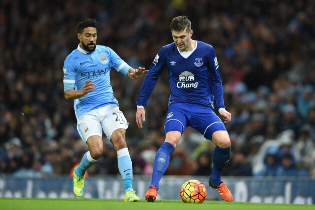 MANCHESTER, ENGLAND - JANUARY 13:  John Stones of Everton is closed down by Gael Clichy of Manchester City  during the Barclays Premier League match between Manchester City and Everton at the Etihad Stadium on January 13, 2016 in Manchester, England.  (Photo by Michael Regan/Getty Images)