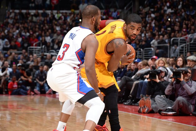 LOS ANGELES, CA -  JANUARY 16: Kyrie Irving #2 of the Cleveland Cavaliers defends the ball against Chris Paul #3 of the Los Angeles Clippers during the game on January 16, 2015 at STAPLES Center in Los Angeles, California. NOTE TO USER: User expressly acknowledges and agrees that, by downloading and or using this Photograph, user is consenting to the terms and conditions of the Getty Images License Agreement. Mandatory Copyright Notice: Copyright 2015 NBAE (Photo by Andrew Bernstein/NBAE via Getty Images)