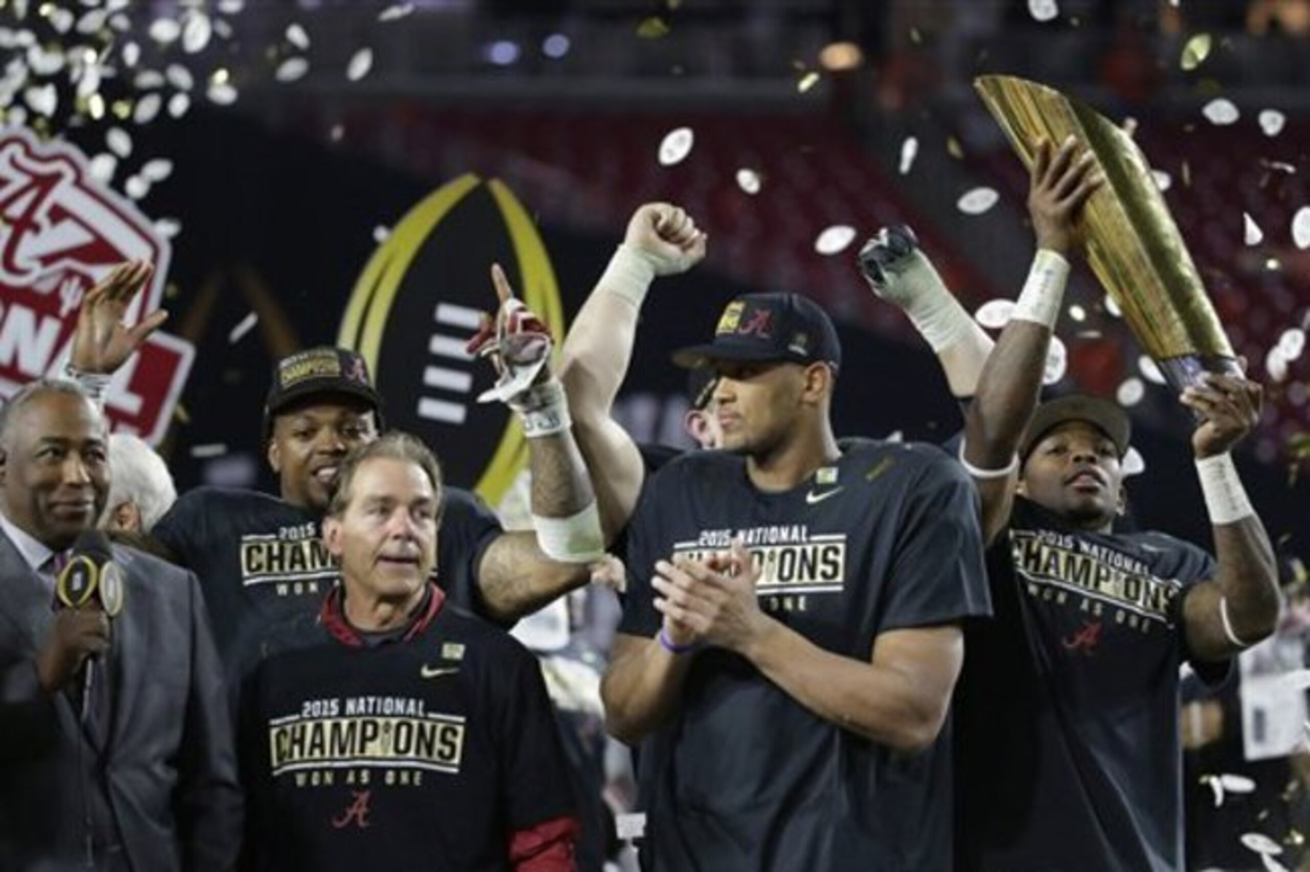 Alabama head coach Nick Saban, second from left, and players celebrate after the NCAA college football playoff championship game against Clemson Monday, Jan. 11, 2016, in Glendale, Ariz. Alabama won 45-40. (AP Photo/Chris Carlson)