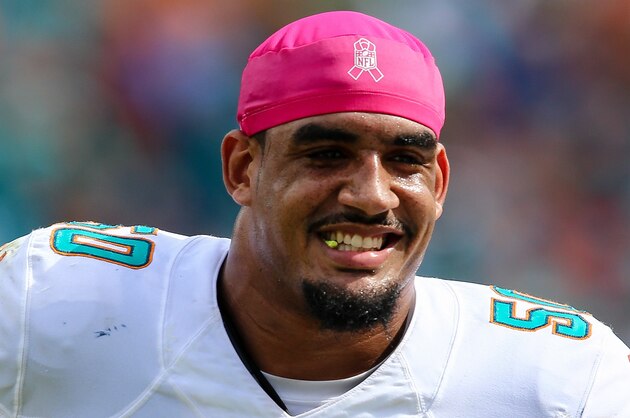 Oct 25, 2015; Miami Gardens, FL, USA; Miami Dolphins defensive end Olivier Vernon (50) reacts after Miami Dolphins running back Lamar Miller (not pictured) ran for a touchdown against the Houston Texans during a game at Sun Life Stadium. Mandatory Credit: Steve Mitchell-USA TODAY Sports