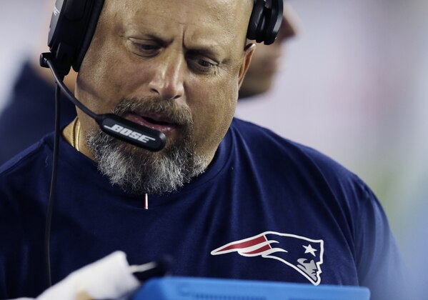 New England Patriots offensive coordinator Dave DeGuglielmo on the sidelines in the first half of an NFL preseason football game against the Carolina Panthers, Friday, Aug. 22, 2014, in Foxborough, Mass. (AP Photo/Charles Krupa)