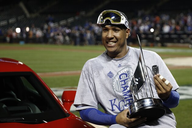 Kansas City Royals catcher Salvador Perez poses with his trophy after being named the MVP after Game 5 of the Major League Baseball World Series against the New York Mets Monday, Nov. 2, 2015, in New York. The Royals won 7-2 to win the series. (AP Photo/Matt Slocum)