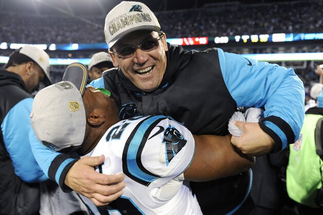 Carolina Panthers head coach Ron Rivera celebrates with Jonathan Stewart after the NFL football NFC Championship game against the Arizona Cardinals, Sunday, Jan. 24, 2016, in Charlotte, N.C. The Panthers won 49-15 to advance to the Super Bowl. (AP Photo/Mike McCarn)