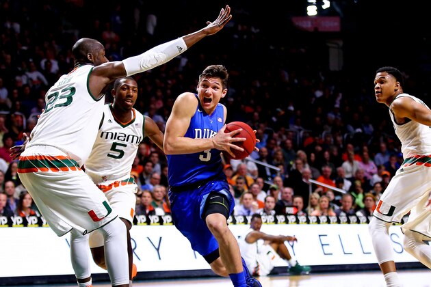 MIAMI, FL - JANUARY 25: Grayson Allen #3 of the Duke Blue Devils drvies to the basket against Tonye Jekiri #23 of the Miami Hurricanes of the game at the BankUnited Center on January 25, 2016 in Miami, Florida.  (Photo by Rob Foldy/Getty Images)