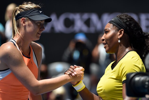 Serena Williams of the US (R) shakes hands with Russia's Maria Sharapova after winning their women's singles match on day nine of the 2016 Australian Open tennis tournament in Melbourne on January 26, 2016. AFP PHOTO / SAEED KHAN --  IMAGE RESTRICTED TO EDITORIAL USE - STRICTLY NO COMMERCIAL USE / AFP / SAEED KHAN        (Photo credit should read SAEED KHAN/AFP/Getty Images)