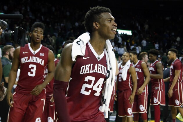 Oklahoma guard Buddy Hield (24) and guard Christian James (3) leave the court after their  NCAA college basketball game with Baylor, Saturday, Jan. 23, 2016, in Waco, Texas. Oklahoma won 82-72. (AP Photo/Rod Aydelotte)